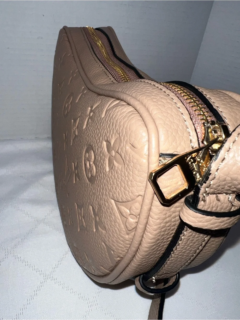 Designer inspired half-moon shoulder bag in a neutral taupe leather w/monogram